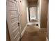 Long hallway with white doors and carpet at 389 Dargan Sw Pl, Atlanta, GA 30310