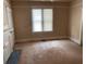 Neutral living room with natural light and fireplace at 389 Dargan Sw Pl, Atlanta, GA 30310