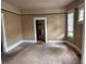 Neutral bedroom featuring light-filled windows and carpeted floor, offering a comfortable retreat at 389 Dargan Sw Pl, Atlanta, GA 30310