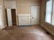 Cozy living room featuring a fireplace, closet, and natural light through large windows at 389 Dargan Sw Pl, Atlanta, GA 30310