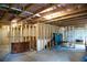 Spacious unfinished basement featuring exposed rafters and a concrete floor provides an opportunity to customize at 4535 Sunflower Cir, Cumming, GA 30040
