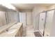 Bathroom featuring tile floors, granite countertops, glass shower and double vanity at 4535 Sunflower Cir, Cumming, GA 30040
