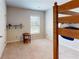 Cozy bedroom highlighting a bunk bed and a small shelf with decorative items at 4535 Sunflower Cir, Cumming, GA 30040