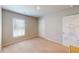 Bright bedroom with a window bringing in natural light and plush carpet flooring at 4535 Sunflower Cir, Cumming, GA 30040