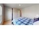 Bedroom featuring a large window, carpet flooring, and doors to closets and access to other rooms at 4535 Sunflower Cir, Cumming, GA 30040