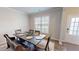 Bright dining area with a large window and an inviting dining set at 4535 Sunflower Cir, Cumming, GA 30040