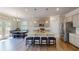 Modern kitchen with stainless appliances, island with seating, hardwood floors, and bright breakfast nook at 4535 Sunflower Cir, Cumming, GA 30040