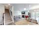 Bright and open kitchen to the living room showcases a fireplace, and hardwood floors at 4535 Sunflower Cir, Cumming, GA 30040