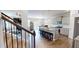 Bright kitchen featuring a granite island with stool seating, stainless appliances and hardwood floors at 4535 Sunflower Cir, Cumming, GA 30040