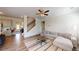 Bright living room showcases hardwood floors, an area rug, neutral paint, and an open concept at 4535 Sunflower Cir, Cumming, GA 30040