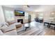 Comfortable living room showcases a fireplace, large windows, hardwood floors, and an open concept at 4535 Sunflower Cir, Cumming, GA 30040