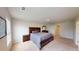 Spacious main bedroom with a queen bed and dark wooden furniture at 4535 Sunflower Cir, Cumming, GA 30040