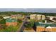Scenic aerial view showcases brick buildings with green roofs in a lively downtown setting at 1161 Dahlonega Hwy # 3, Cumming, GA 30040