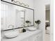 Well-lit bathroom featuring a double sink vanity, sleek fixtures, and modern lighting, offering a clean and contemporary design at 1161 Dahlonega Hwy # 3, Cumming, GA 30040