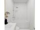 Bright bathroom featuring a sleek white tub and modern shower fixtures at 1161 Dahlonega Hwy # 3, Cumming, GA 30040