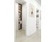 Hallway showcasing a pantry, built-in shelves, and neutral decor at 1161 Dahlonega Hwy # 3, Cumming, GA 30040