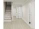 Inviting hallway featuring bright flooring and an open staircase, creating a seamless transition throughout the home with a naturally lit space at 1161 Dahlonega Hwy # 3, Cumming, GA 30040