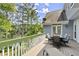 Back deck with outdoor seating area overlooking lake at 3260 Kingshouse Commons, Johns Creek, GA 30022