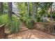 Pathway to backyard with beautiful lake view, mature trees, and a gazebo at 3260 Kingshouse Commons, Johns Creek, GA 30022
