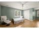 Inviting bedroom with hardwood floors, neutral walls, and ample natural light at 3260 Kingshouse Commons, Johns Creek, GA 30022
