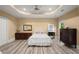 Bedroom features wood floors, ample natural light and neutral colors at 3260 Kingshouse Commons, Johns Creek, GA 30022