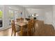 Dining room flows into living room and features hardwood floors and natural light at 3260 Kingshouse Commons, Johns Creek, GA 30022