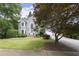 Charming two-story home with a well-manicured lawn and beautiful landscaping at 3260 Kingshouse Commons, Johns Creek, GA 30022