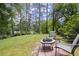 Relaxing backyard area with fire pit, perfect for outdoor gathering near a beautiful lake at 3260 Kingshouse Commons, Johns Creek, GA 30022