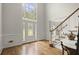 Bright and spacious foyer with high ceilings, hardwood floors, and an elegant staircase at 3260 Kingshouse Commons, Johns Creek, GA 30022