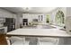 Bright kitchen features white countertops, stainless appliances and large window at 3260 Kingshouse Commons, Johns Creek, GA 30022
