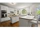 Bright kitchen featuring white cabinetry, stainless steel appliances, and a center island at 3260 Kingshouse Commons, Johns Creek, GA 30022