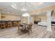 Large, open-concept living space with dining table, bar, and comfortable seating, perfect for entertaining at 3260 Kingshouse Commons, Johns Creek, GA 30022