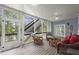 A relaxing screened-in porch with comfortable seating and scenic backyard views at 3260 Kingshouse Commons, Johns Creek, GA 30022