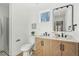 This well-lit bathroom offers a new vanity, double sinks, a framed mirror, and a separate shower at 3939 Hamilton Mill Rd, Buford, GA 30519