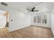 This bright bedroom features neutral walls, a ceiling fan and three windows offering natural light at 3939 Hamilton Mill Rd, Buford, GA 30519