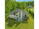 Beautiful aerial view of the home with a large backyard and deck at 3939 Hamilton Mill Rd, Buford, GA 30519