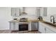 Kitchen featuring stainless steel appliances, light grey cabinets, and wooden countertops at 3939 Hamilton Mill Rd, Buford, GA 30519
