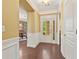 Spacious foyer with hardwood floors, elegant trim, and views into the dining room, creating a grand entrance at 4535 Vanadium Bnd, Cumming, GA 30040