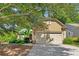 Charming single-Gathering home boasts a lush front yard and a two-car garage, complemented by mature trees and landscaping at 4535 Vanadium Bnd, Cumming, GA 30040