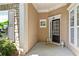Inviting front porch with decorative columns and front door, creating a warm welcome to this lovely home at 4535 Vanadium Bnd, Cumming, GA 30040