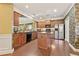 Spacious kitchen includes granite counters, stainless steel appliances, and a functional island for meal preparation at 4535 Vanadium Bnd, Cumming, GA 30040