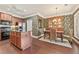 Open-concept kitchen flows into the dining area, showcasing granite countertops, stainless appliances, and modern finishes at 4535 Vanadium Bnd, Cumming, GA 30040