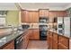 Well-equipped kitchen featuring granite countertops, stainless steel appliances, and ample storage space at 4535 Vanadium Bnd, Cumming, GA 30040