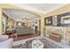 Open living area showcasing hardwood floors, a fireplace, and stylish furnishings at 4535 Vanadium Bnd, Cumming, GA 30040