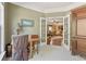 Bright office with French doors leading to the living room and custom built-in cabinetry at 4535 Vanadium Bnd, Cumming, GA 30040