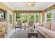 Sunroom filled with light offers casual seating and a decorative rug at 4535 Vanadium Bnd, Cumming, GA 30040