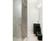 Bathroom with standing shower, black cabinet sink, and tiled floors at 5150 Wheat Ne St, Covington, GA 30014