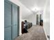 Carpeted bedroom with view of light fixture, bed, and window at 5150 Wheat Ne St, Covington, GA 30014