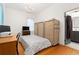 Bright bedroom with hardwood floors, closet, and desk at 5150 Wheat Ne St, Covington, GA 30014