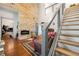 Cozy living room with hardwood floors, fireplace, wood wall and staircase to upper level at 5150 Wheat Ne St, Covington, GA 30014